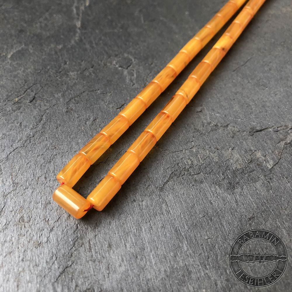 Hareli sarı 5,5x9,5mm sıkma kehribar kesme model tesbih