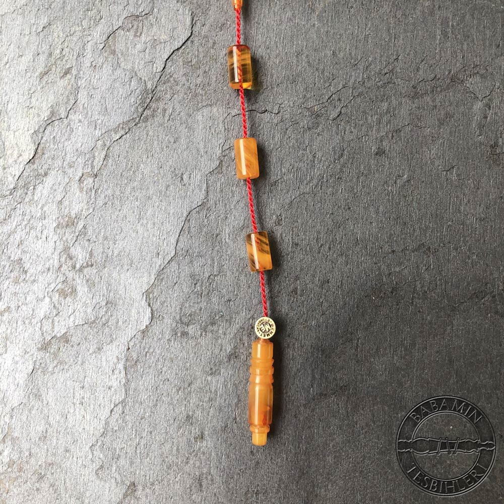 Hareli sarı 5,5x9,5mm sıkma kehribar kesme model tesbih
