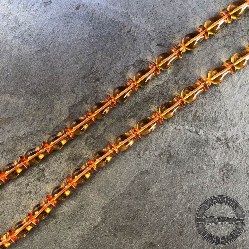Şeffaf sarı 7x12mm lale model, sıkma kehribar tesbih